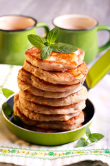 Pile of oat pancakes with syrup