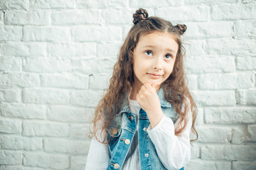 An Adorable little girl on studio white background