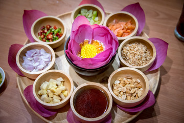 food wrapped in lotus leaves with a herb ingredient