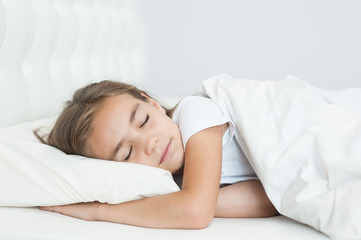 Fototapeta na wymiar Beautiful little girl sleeping in bed