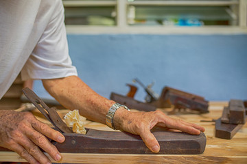 Carpenter working for timber table wooden