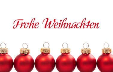 red christmas balls with german text Frohe Weihnachten - in english Merry christmas