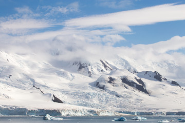 Snow and glaciers on top of mountains in the South Shetland Islands, Antarctica.