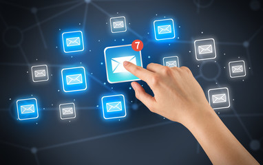 Hand touching mail icon