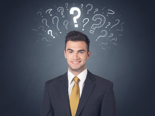 Businessman with question marks