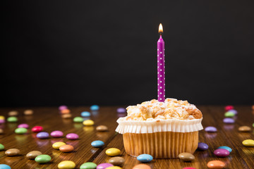cupcake with burning candle