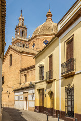 Obraz premium View from narrow street at the church Santa Maria in Ecija, Spain