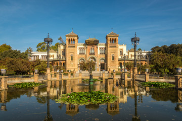 Fototapeta na wymiar View at the building Museum of Art with fountain in Sevilla, Spain