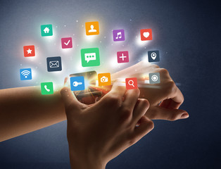 Female hand wearing smartwatch with app icons