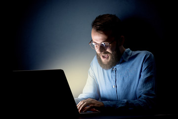 Businessman in the office at night