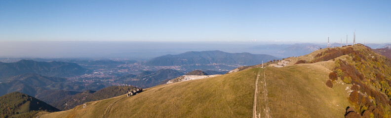 Naklejka premium Morning landscape on the Padana plain with high pollution and humidity in the air. Panorama from Linzone Mountain, Bergamo, Italy