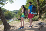 Young hiker girl end boy with backpack. Eco tourism and healthy lifestyle concept