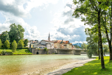 Fototapeta premium Isar river and bridge that leads to old town Bad Tolz, Bavaria, Germany