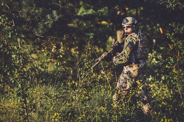 soldier of special forces in action pointing target and giving attack direction.