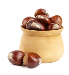 chestnut in a wooden bowl isolated on white background. Top view