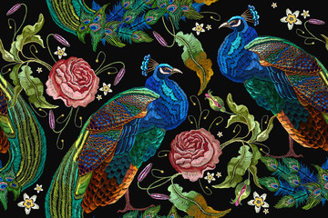 Embroidery peacocks and flowers peonies seamless pattern. Classical fashionable embroidery beautiful peacocks. Fashionable template for design of clothes. Tails of peacocks and roses © Matrioshka