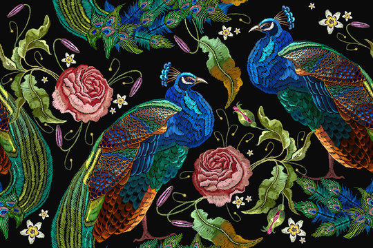 Embroidery peacocks and flowers peonies seamless pattern. Classical fashionable embroidery beautiful peacocks. Fashionable template for design of clothes. Tails of peacocks and roses