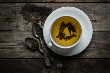 Green tea in white cup