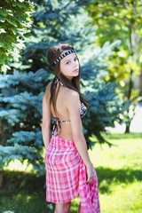 Fashionable young woman in park