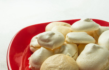 red plate with meringues