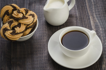 cookies and coffee on a wooden table/cookies and coffee on a wooden table. Top view