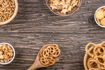 Beer snacks on a wooden table.Top view with copy space.