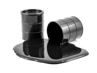 Oil is poured out of the barrel and full barrel of oil. Isolated on white.