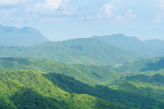 Fototapeta beautiful landscape nature of rain forest and mountain background. nice place for outdoor travel on vacation or holidays. tropical forest of thailand.