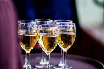 Glasses with champagne on the tray