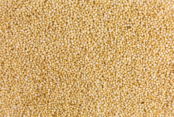 background of white puffed quinoa seeds - chenopodium quinoa