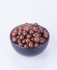 chocolate balls. chocolate balls in bowl on a background