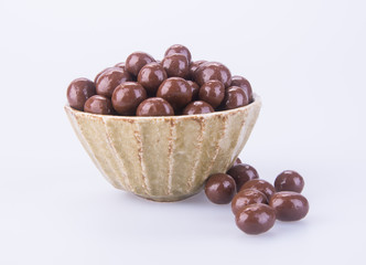 chocolate balls. chocolate balls in bowl on a background