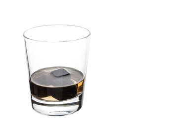 A full glass with whiskey stones. Isolated.