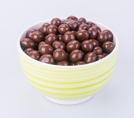 chocolate balls. chocolate balls in bowl on a background