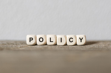 Word POLICY made with wood building blocks
