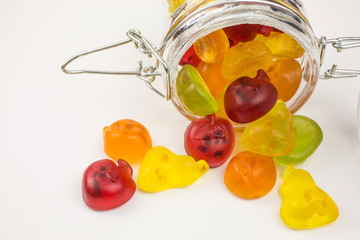 fruity gummy candies in a glass jar