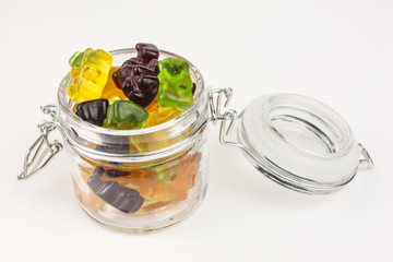 fruity gummy bears in a glass jar