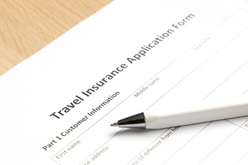 Travel insurance application form wait to fill information on desk background
