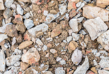 Construction breaking up concrete using a hammer drill