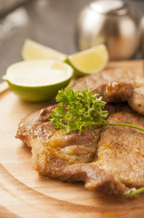 Croquettes with pork served on a wooden tray