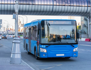 bus goes along street