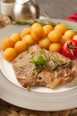 Croquettes with pork served on a wooden tray