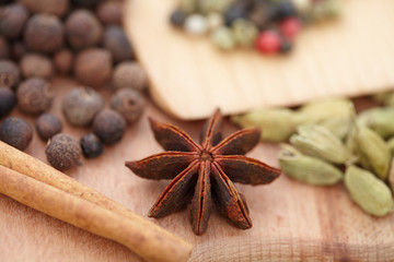 Various seasonings on wooden background