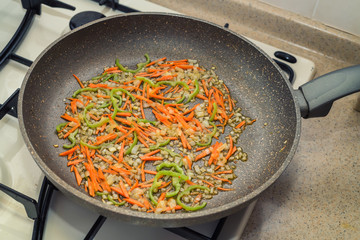 Chopped vegetables on frying pan healthy food