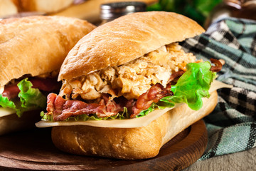 Ciabatta sandwich with smoked bacon and eggs