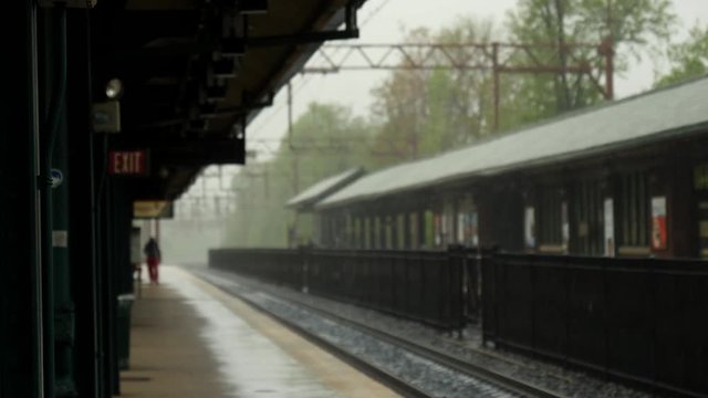Quiet, small train station in rain, USA.