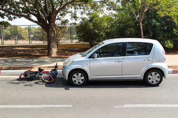 Fototapeta na wymiar A traffic accident between electric bicycle and car