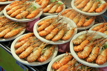 Grilled shrimp on a plate stacking on top of each other