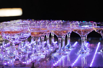 Glasses of champagne. Pyramid of wineglasses.