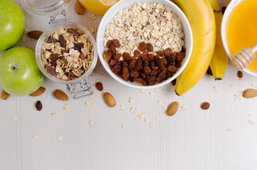 Healthy Breakfast. Granola, apples, bananas, oatmeal with raisins, honey, nuts. Measuring tape